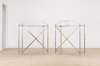 Lot 567 - A pair of modernist metal and glass console tables