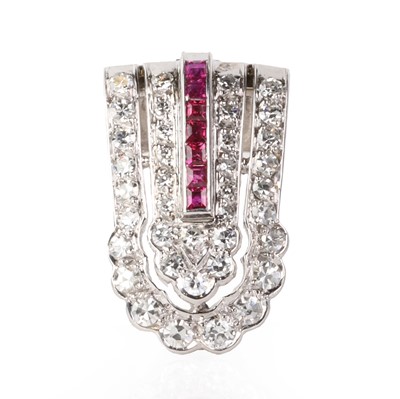 Lot 75 - A diamond and ruby clip brooch, c.1940