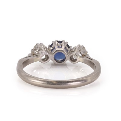 Lot 108 - A three stone diamond and sapphire ring