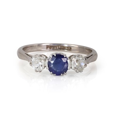 Lot 108 - A three stone diamond and sapphire ring
