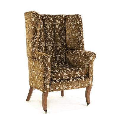 Lot 473 - A barrel back armchair