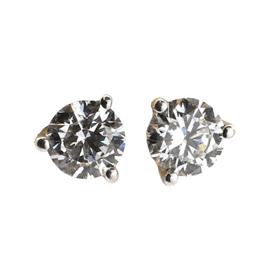 Lot 79 - A pair of single stone diamond stud earrings