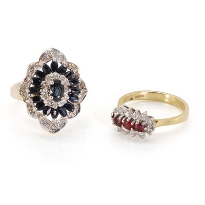 Lot 216 - An 18ct gold ruby and diamond ring and a 9ct gold sapphire cluster ring