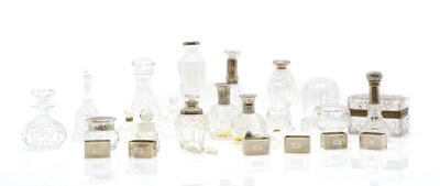 Lot 48 - A group of five silver mounted cut glass bottles