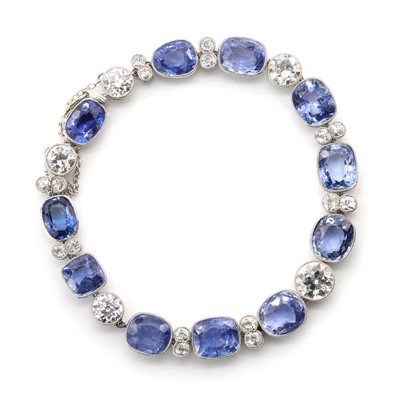 Lot 56 - A Ceylon sapphire and diamond rivière bracelet, c.1920