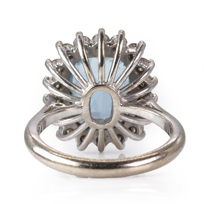 Lot 192 - An 18ct white gold aquamarine and diamond cluster ring