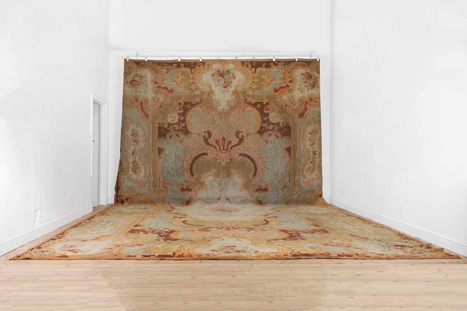 Lot 622 - A large Louis XV-style Aubusson carpet