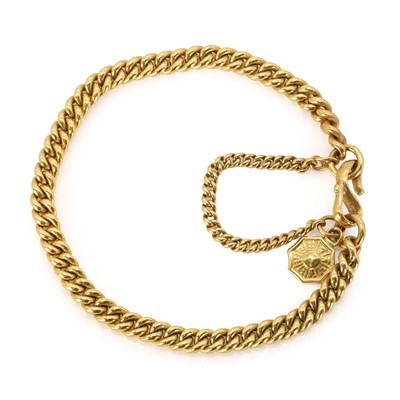 Lot 333 - A gold curb bracelet, with a Chinese 'Bagua' charm