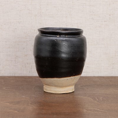 Lot 5 - A Chinese black-glazed jar