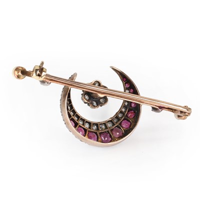 Lot 21 - A late Victorian ruby, diamond and pearl crescent brooch