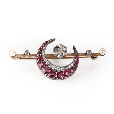 Lot 21 - A late Victorian ruby, diamond and pearl crescent brooch
