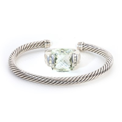 Lot 256 - A silver torque bangle and a prasiolite ring, by David Yurman