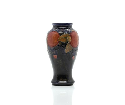 Lot 153 - A William Moorcroft 'Pomegranate' pattern pottery vase