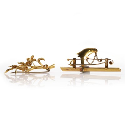 Lot 20 - A late Victorian bird bar brooch and a floral spray brooch