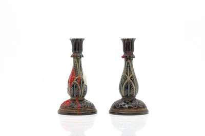 Lot 141 - A pair of Doulton Lambeth stoneware candlesticks