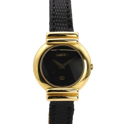 Lot 35P - A ladies' gold plated Gucci quartz strap watch