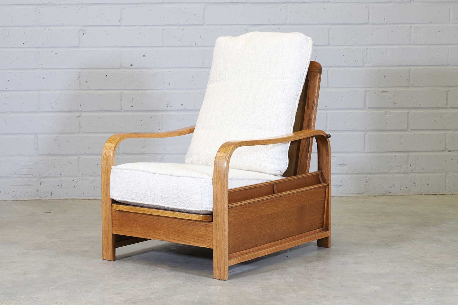 Lot 39 - An oak reclining reading chair