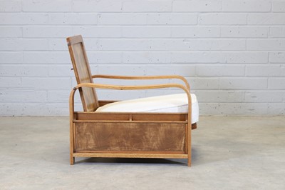 Lot 39 - An oak reclining reading chair