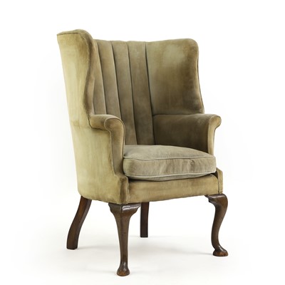 Lot 425 - A barrel back armchair