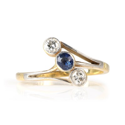 Lot 174 - A diamond and sapphire three stone ring