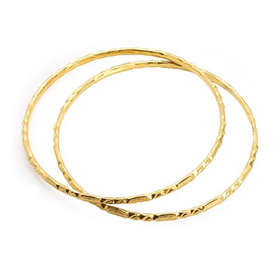 Lot 325 - Two high carat gold bangles