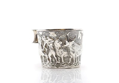 Lot 23 - A silver repousse mug