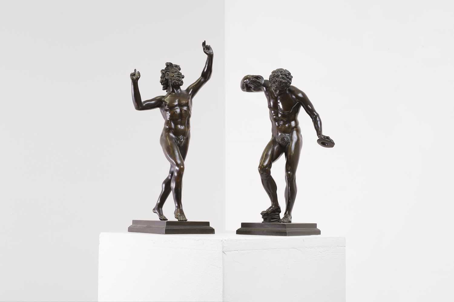 Lot A pair of grand tour bronze figures