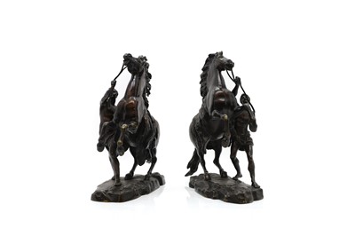 Lot 220 - A pair of patinated bronze sculptures