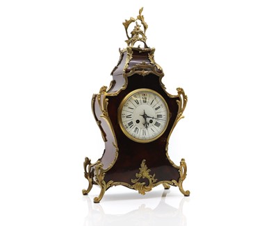 Lot 265 - A French faux tortoiseshell mantle clock