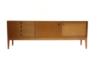 Lot 424 - A teak sideboard