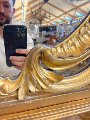 Lot 370 - A George III carved giltwood overmantel mirror