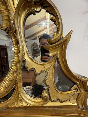 Lot 370 - A George III carved giltwood overmantel mirror