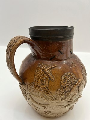 Lot 142 - A group of four salt glazed stoneware 'Harvest' jugs