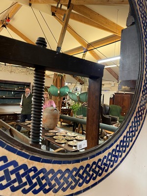 Lot 77 - A metal and glazed tile mirror