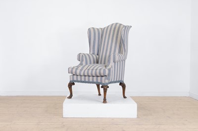 Lot 2 - A Queen Anne-style walnut wing-back armchair