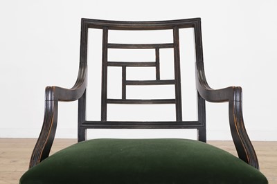 Lot 62 - An Aesthetic Period ebonised walnut elbow chair in the manner of E W Godwin