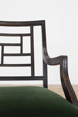 Lot 62 - An Aesthetic Period ebonised walnut elbow chair in the manner of E W Godwin