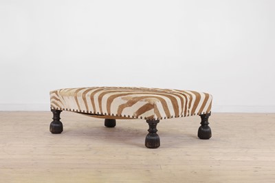 Lot 63 - A stained wood and zebra skin stool