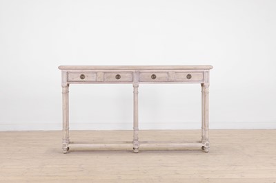 Lot 12 - A distressed wooden serving table by OKA