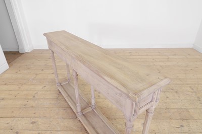 Lot 12 - A distressed wooden serving table by OKA