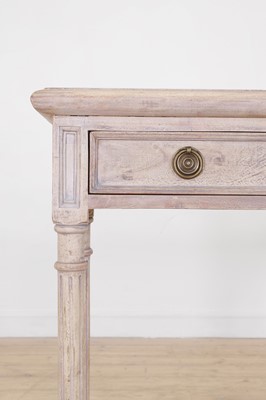 Lot 12 - A distressed wooden serving table by OKA