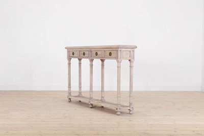 Lot 12 - A distressed wooden serving table by OKA