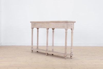 Lot 12 - A distressed wooden serving table by OKA