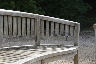 Lot 98 - A pair of curved teak garden benches