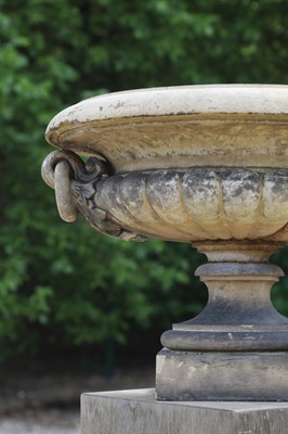 Lot 101 - A buff terracotta garden urn in the manner of J M Blashfield