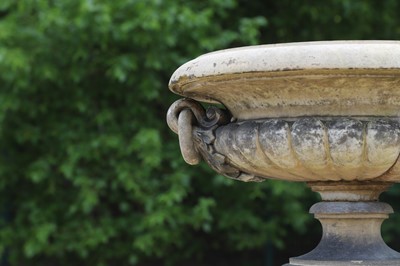 Lot 101 - A buff terracotta garden urn in the manner of J M Blashfield