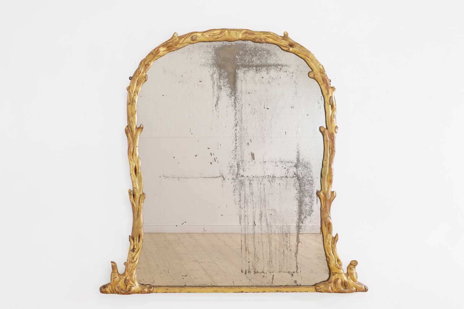 Lot 4 - A giltwood 'faux bois' overmantel mirror