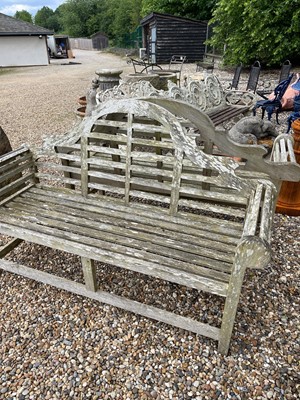 Lot 96 - A pair of teak garden benches in the manner of Edwin Lutyens