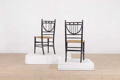 Lot 75 - A pair of ebonised wooden side chairs