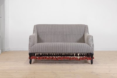 Lot 57 - An ebonised wooden sofa by OKA